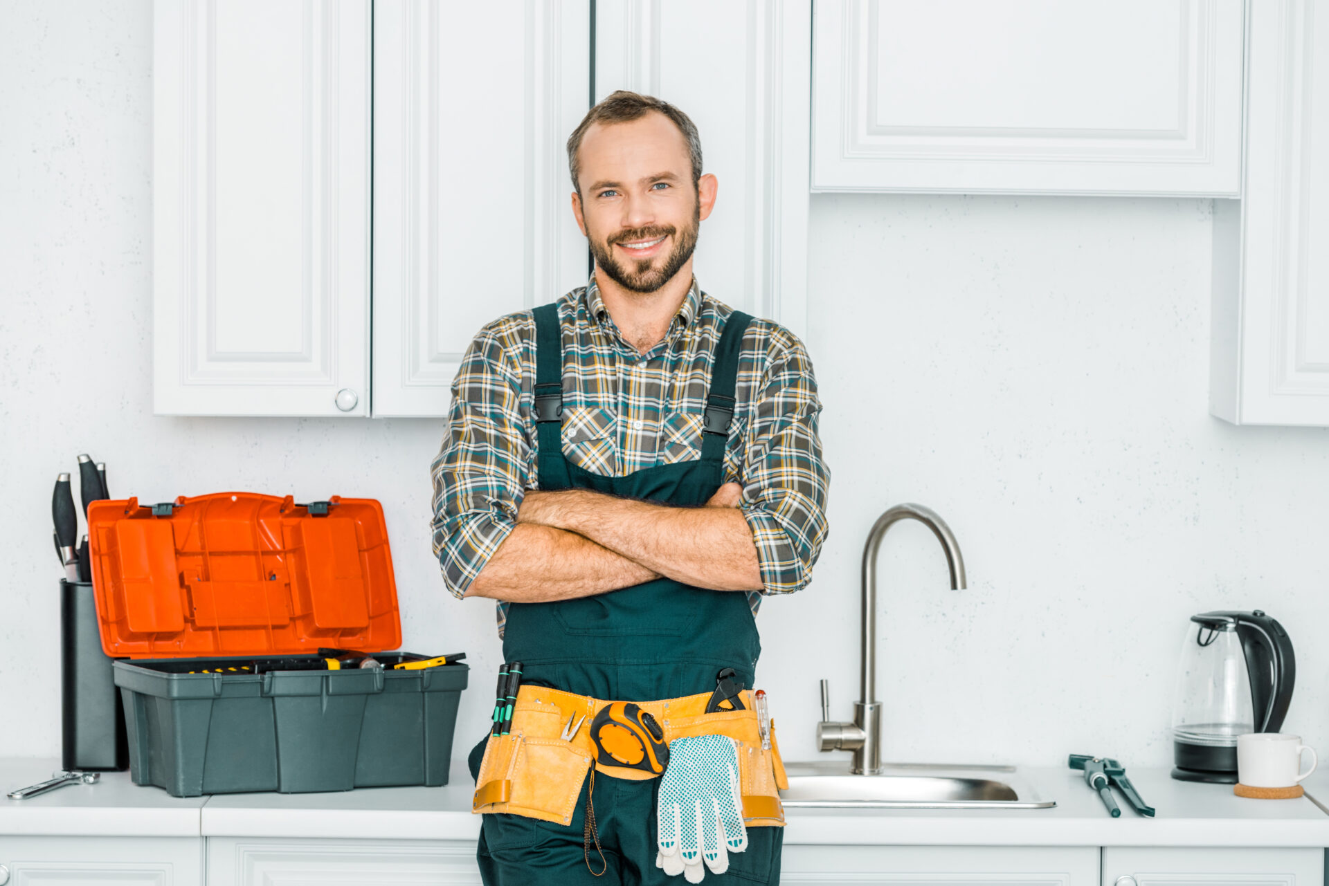 Smiling,Handsome,Plumber,Standing,With,Crossed,Arms,And,Looking,At