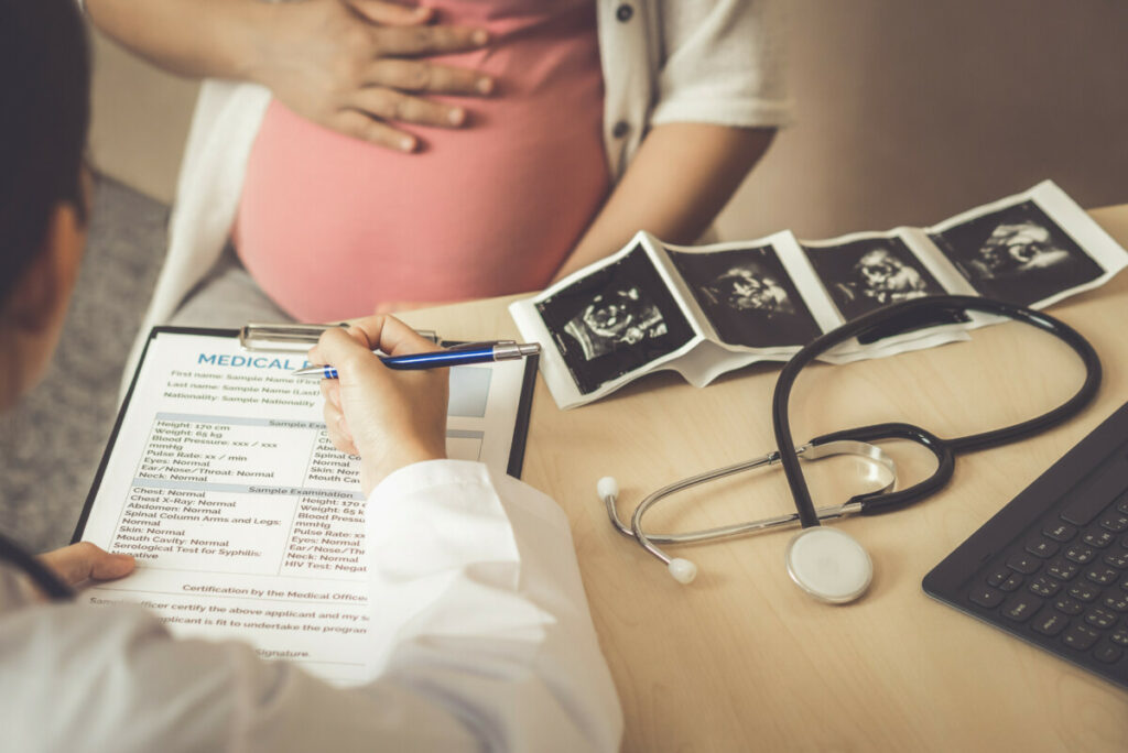 Pregnant Woman and Gynecologist Doctor at Hospital